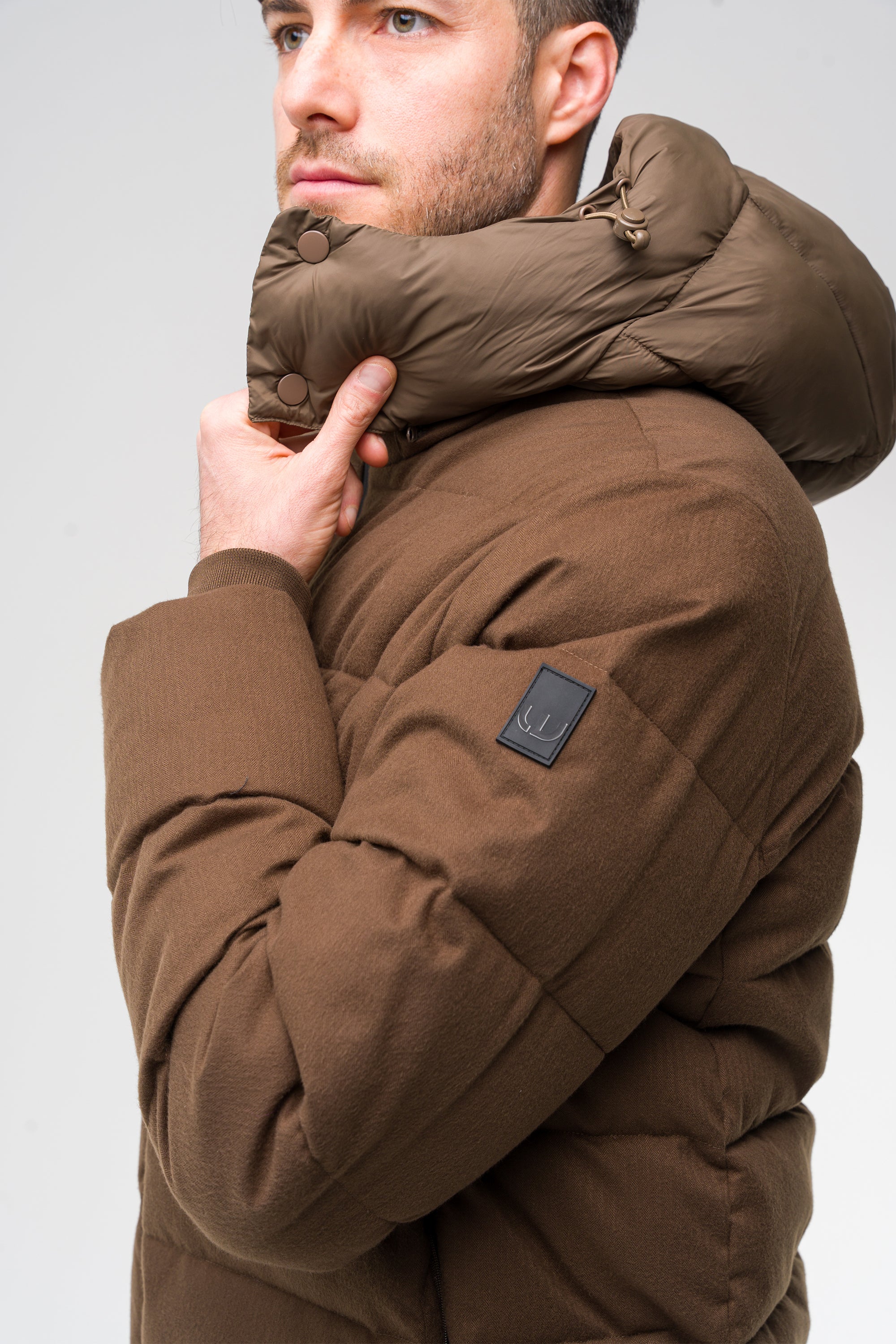 Two-material padded jacket with hood