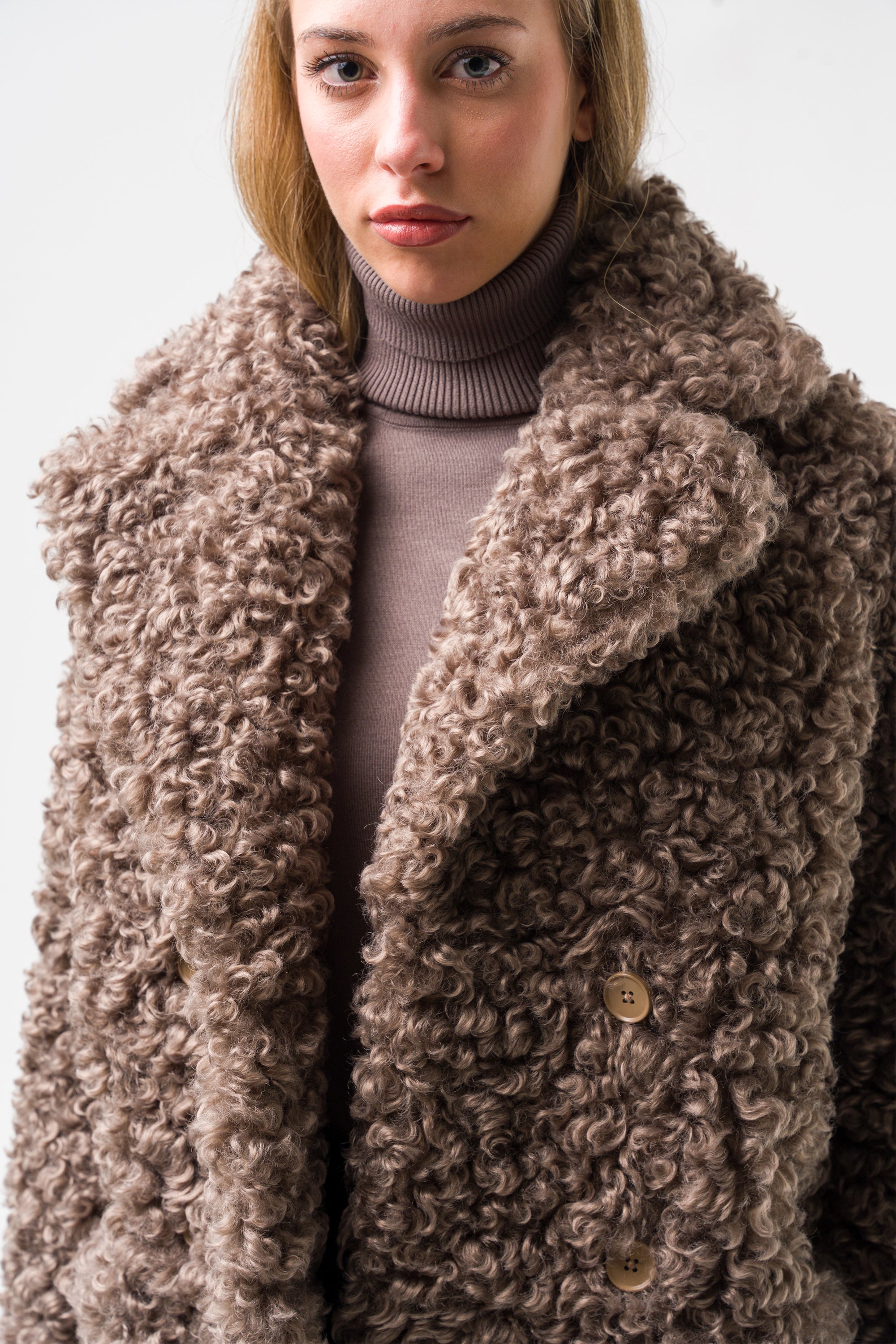 Double-breasted faux fur coat